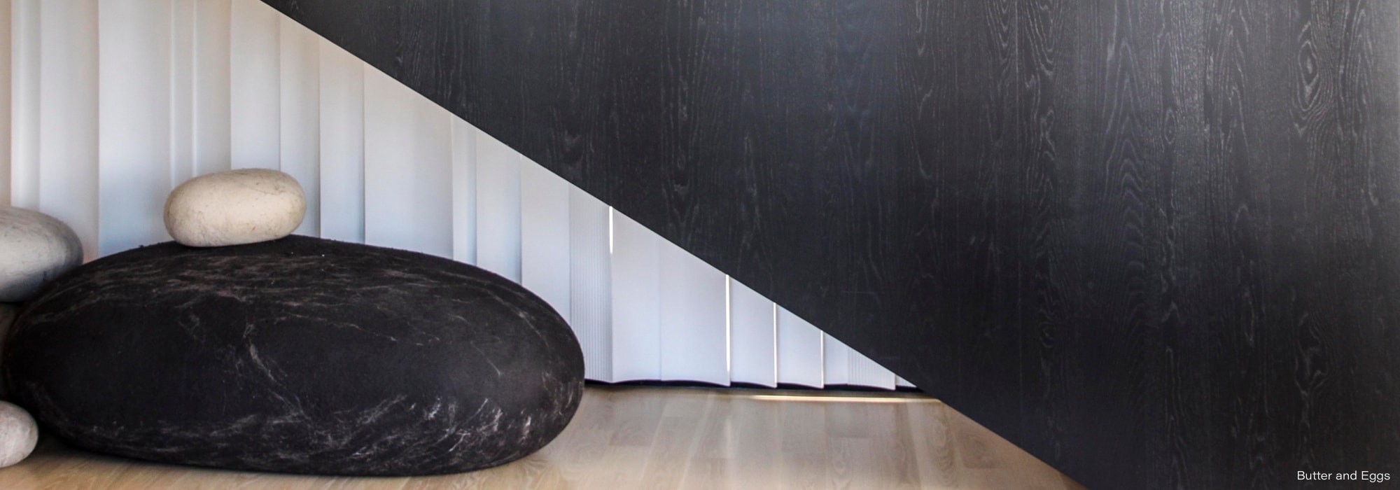 Butter and Eggs — minimalist spa interior with stone basin